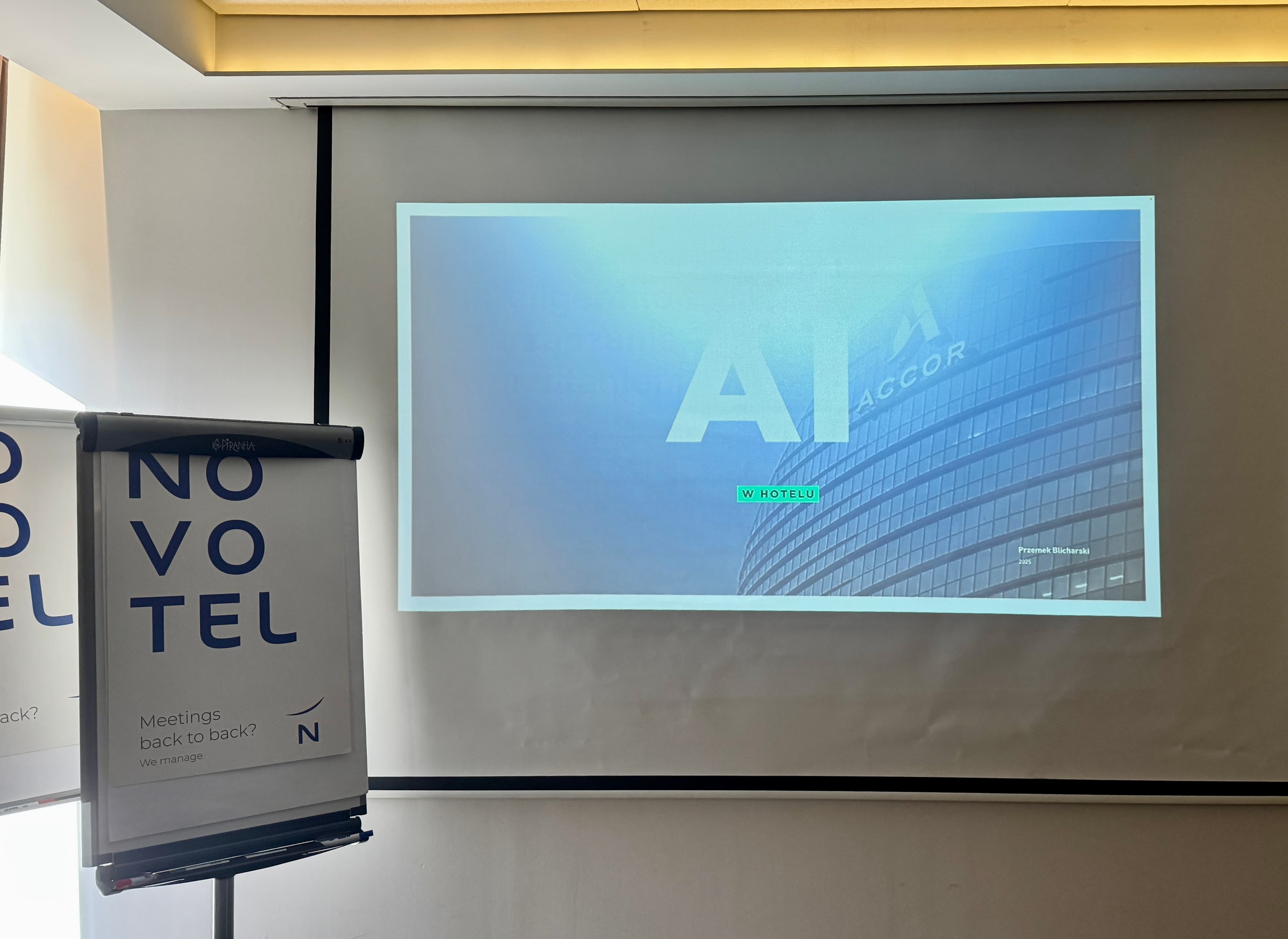 Novotel training room with an Accor AI presentation on the screen